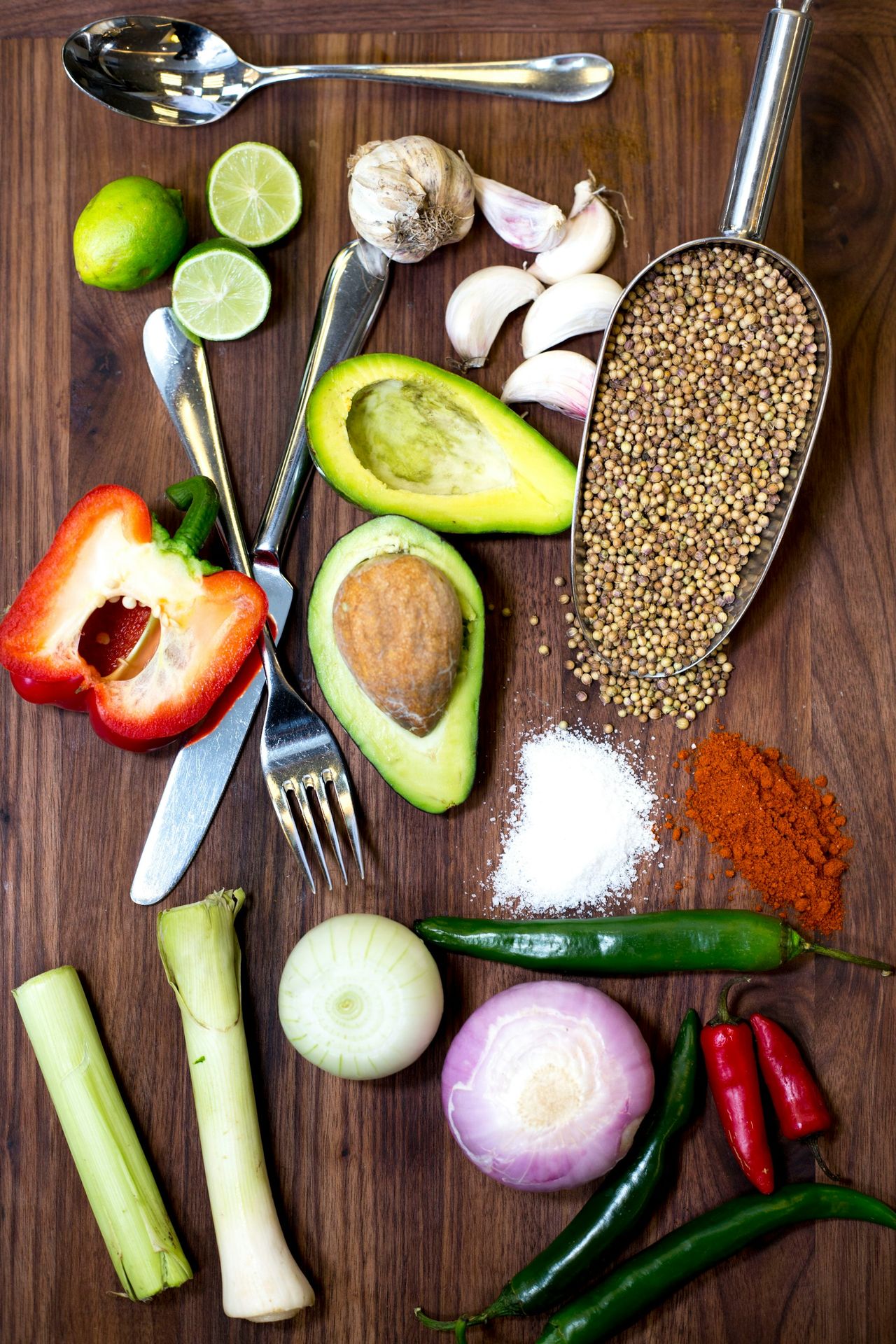 sliced avocado and tomato on chopping board
